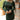 Close up view of model wearing the Unforgettable Dress which features green sheen fabric, smalls slits on each side of the hem, ruching on the sides, round neckline, lining and long sleeves.