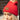 Side view of model wearing the Anchorage Beanie in Red, that has red knit fabric with a stitched pattern, a front patch that says "C.C exclusives", and a brown faux-fur pompom.
