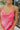 Frontal view of the Pink Dreams Dress that features a monochromatic pink houndstooth pattern, a cowl neckline, a sleeveless design with thin adjustable straps, and a side slit.