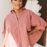 Frontal view of the Summer Chapter Top that features a dark rose colored material, a collared neckline, an oversized half sleeve, and a button down front.