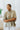 Frontal view of the Summer Chapter Top that features an olive colored material, a collared neckline, an oversized half sleeve, and a button down front.