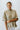 Frontal view of the Summer Chapter Top that features an olive colored material, a collared neckline, an oversized half sleeve, and a button down front.
