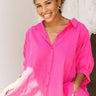 Frontal view of the Summer Chapter Top that features a hot pink colored material, a collared neckline, an oversized half sleeve, and a button down front.