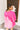 Back view of the Summer Chapter Top that features a hot pink colored material, a collared neckline, an oversized half sleeve, and a button down front.