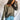 Front view of model wearing the Lost Without You Sweater, which features olive open-knit fabric with larger knitting on the sides, a round neckline, long sleeves, and a slouchy fit.