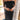 Close-up front view of model wearing the Magic Moment Dress in Black, which features black satin fabric with a midi-length hem, black feathers across the neckline, adjustable thin straps, and a back zipper