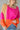 front view of model wearing the Noa Color Block Long Sleeve Sweater that has a pink, yellow, and orange color block pattern, long balloon sleeves with ribbed wrists, a round neckline, and oversized fit.