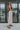 Full body side view of model wearing the Trend Setter Cargo Midi Skirt that has taupe light weight fabric, side cargo pockets, an elastic waist with a black drawstring tie, two upper pockets and a back slit