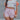Front view of model wearing the Casually Chic Shorts which features light pink fabric, two side pockets with covered button closure, elastic waistband and drawstring tie.