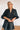 Frontal view of the Show Time Bodysuit that features a black satin material, a V neckline, a flowy half sleeve with a feather trim, and a bikini bottom with a snap closure.