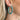 The Lucky Me Earring is a metallic blue, hoop style earring.