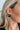 The Love To Love Earring is a black, stud earring featuring a heart shape outlined in white.