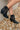 Side view of the Zane Western Bootie features a black leather upper, an almond toe, western inspired embroidery through out, side pull tabs for easy entry/exit, and a 3" block heel.
