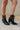 Front/ Side view of the Zane Western Bootie features a black leather upper, an almond toe, western inspired embroidery through out, side pull tabs for easy entry/exit, and a 3" block heel.