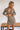 Frontal view of the It Takes Two Skirt that features a beige colored tweed material, a brown and black gingham print, a high-rise fit, a thick waist band, a curved bottom hem, a side zipper closure, and a mini length.