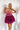 Frontal view of the Pinky Promise Mini Dress that features a tulle material, a monochromatic tiered design, a straight neckline, a sleeveless design with thin adjustable straps, a back zipper closure, and a mini length.