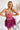 Frontal view of the Pinky Promise Mini Dress that features a tulle material, a monochromatic tiered design, a straight neckline, a sleeveless design with thin adjustable straps, a back zipper closure, and a mini length.