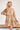 Frontal view of the Count On Me Dress that features an ivory colored material, a multi-colored floral print, a V neckline, a 3/4 sleeve, a button-up front, a tiered design, and a mini length.