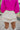 Back view of the One To Watch Skort In Cream that features an ivory faux-leather material, a thick elastic waist band with a tie detail, a tiered ruffle design, a shorts lining, and a flowy fit