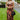 Frontal view of the What's New Midi Dress that features a copper colored silk material, a black abstract print, a V neckline, a sleeveless design with thin adjustable straps, a side slit, and a midi length.