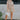 Full body front view of model wearing the Floral Haze Romper that has white denim fabric with a floral pattern, folded hems, pockets, snap closures, a collared neckline, and short sleeves