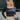Front view of model wearing the On Your Mind Top in Black which features black knit fabric, cropped waist, round neckline and long sleeves.
