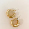 The Classic Things Earring is a gold hoop style earring, featuring an edged design through out. 