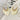 The Don't Blame Me Earring is a dangle style earring, featuring gold detailing and an ivory palm shaped body.