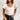 Frontal view of the Game-On Bodysuit that features a white ribbed material, a V neckline, a ruffled short sleeve, and a thong bottom with a snap closure.