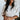 Front view of model wearing The Right Cord Top features lightweight cream-colored corduroy, a round neckline, 3/4 sleeves with elastic wrists, a keyhole button back, and a back zipper