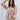 Front view of model wearing the In The Groove Top, which features a blue, pink, orange, and yellow floral print, long balloon sleeves with elastic trim , a square neckline, and a flowy babydoll fit