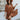 Front view of model wearing the Spice It Up Dress, which features camel-colored fabric, a v-neckline with a cutout, a v-back with a tie, half sleeves, and a flowy fit