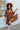 Front view of model wearing the Spice It Up Dress, which features camel-colored fabric, a v-neckline with a cutout, a v-back with a tie, half sleeves, and a flowy fit