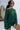 Front view of model wearing the Headed North Top, which features hunter green fabric with horizontal stitched stripes, a round neckline, long sleeves, and a wide cropped fit.
