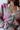 Close-up front view of the Full Bloom Cardigan, which features a grey colored knit material, a multi-colored floral pattern, a V neckline, a button-up front, and long sleeves