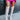 Close-up front view of model wearing the Stephanie Boot in Taupe, which is a tall white boot featuring a taupe faux leather, a 3" stacked heel, a pointed toe, and pull-on tabs. 