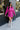 Full body front view of model wearing the Stephanie Boot in Taupe, which is a tall white boot featuring a taupe faux leather, a 3" stacked heel, a pointed toe, and pull-on tabs. 