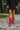 Front view of modeling wearing The Red Hot Western Boot which features faux leather, western stitching, and a 2" heel. These boots run small, we suggest sizing up half a size! 