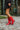 Side view of model wearing The Red Hot Western Boot which features faux leather, western stitching, and a 2" heel. These boots run small, we suggest sizing up half a size! 