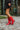 Side view of model wearing The Red Hot Western Boot which features faux leather, western stitching, and a 2" heel. These boots run small, we suggest sizing up half a size! 
