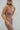 Side view of model wearing The Work It Out Tank which features soft mocha-colored ribbed fabric, two thick straps on each shoulder, and a cropped waist.