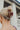 Back image of model's hair; model is wearing the the Harper Hair Clip in Wine, which is a dark red rectangular plastic clip with claw teeth.