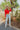 Full body front view of model wearing the New Day Mock Neck Top, which features red ribbed knit fabric with a mock neckline, long sleeves, and a cropped waist