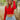 Front view of model wearing the New Day Mock Neck Top, which features red ribbed knit fabric with a mock neckline, long sleeves, and a cropped waist