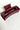 Side view of the Harper Hair Clip in Wine, which is a dark red rectangular plastic clip with claw teeth.