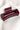 Side view of the Harper Hair Clip in Wine, which is a dark red rectangular plastic clip with claw teeth.