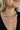 Close up view of model wearing the Take A Walk Necklace in Silver which features silver double chain layer with a rectangle design medallion.