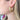 Side view of model wearing the Double The Fun Earrings which features brushed gold colors with dimensional shape.