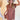Front view of model wearing the Look At You Satin Dress that has terracotta satin fabric, two front chest pockets, v-neckline and cuffed short sleeves
