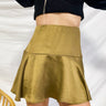 Frontal view of the Make It Mine Skort that features a moss green silk material, a high-rise fit, an elastic waist band, a flowy ruffle bottom, a shorts lining, and a back zipper closure.